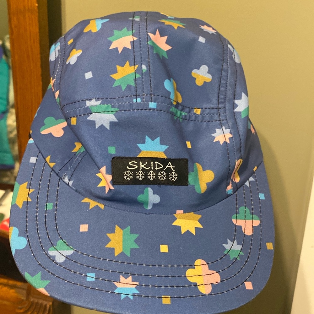 Skida cap, never worn.